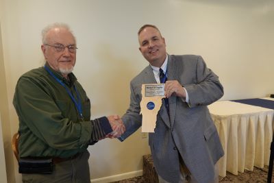 Michael Billingsley of Plainfield accepting the Emergency Management Director of the Year Award from Vermont Public Safety Deputy Commissioner Dan Baitse