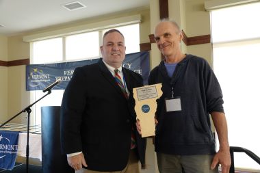 Vermont Emergency Management Director of the Year Nick Emlen posing next to Vermont Public Safety Deputy Director Dan Batsie after receiving his award
