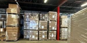 A warehouse with several large cardboard boxes